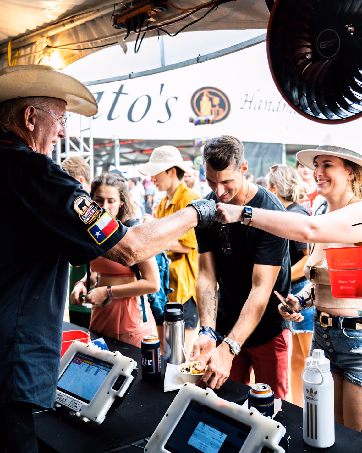 Kent Black fist bumping a customer at ACL in Austin Texas
